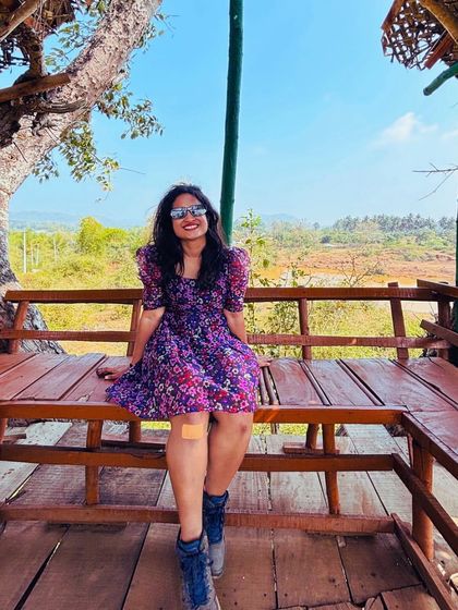 A traveler enjoying the treehouse vibe at a stay in Coorg. Our accommodations are part of the experience.