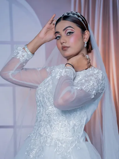 A close-up of the Christian bridal look, showing the soft, blended eyeshadow and the flawless skin finish. The look is romantic and modern.