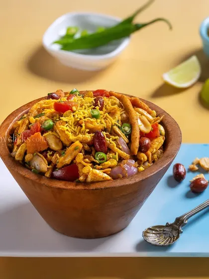 A bowl of savory Bhel Puri from Gulab Sweets, a light and crunchy snack.