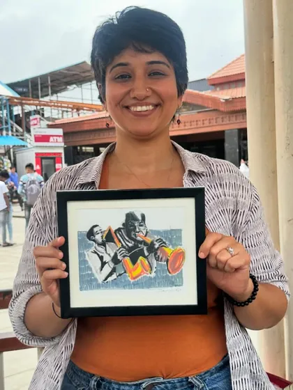 Here I am, happily holding the framed artwork I created for Candies Cafe. It's always a pleasure to give back to the local places that inspire me.