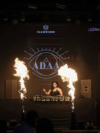 This is me in my element, commanding the stage at Illuzion. I bring the full experience to every gig, complete with pyrotechnics and high-energy visuals that make for an unforgettable night.