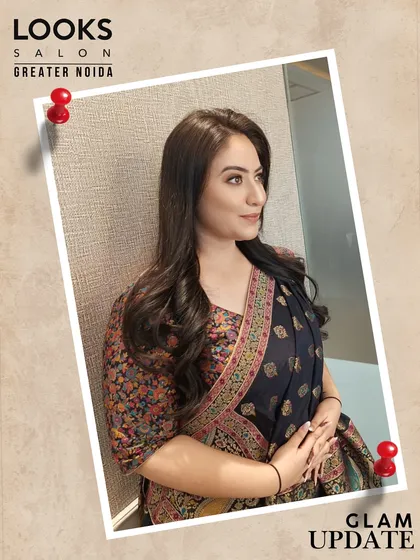 This image shows the full effect of the elegant party look. The makeup and hair perfectly complement her beautiful embroidered saree, creating a look of understated luxury.