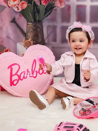 Welcome to the Barbie world. This themed shoot shows how we can use detailed props and a perfectly pink setup to bring your child's favorite character to life.