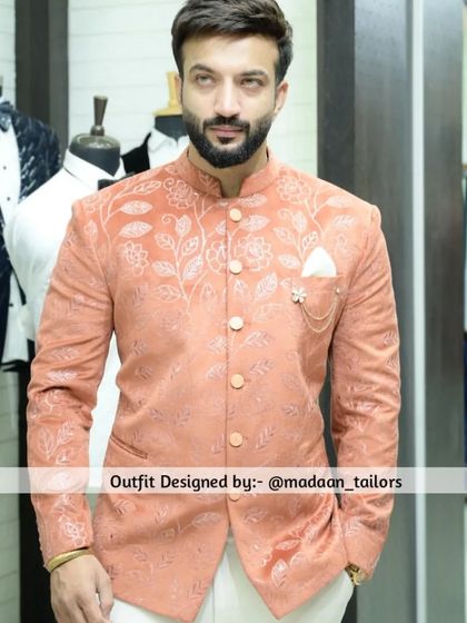 The same peach Jodhpuri blazer, seen from the front. This piece is perfect for a daytime wedding event or a festive celebration.