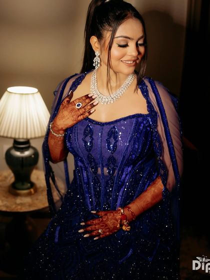 A close-up of my client in the active blue lehenga, where true style is all about the details.