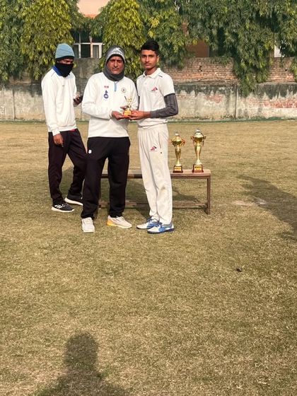 A senior player being awarded for his contribution in the drawn Test match. Every player's effort is acknowledged.