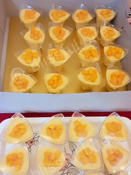 Trays of my creamy Mango Soufflé Shots, showcasing how I prepare bulk orders for events while maintaining quality and presentation.
