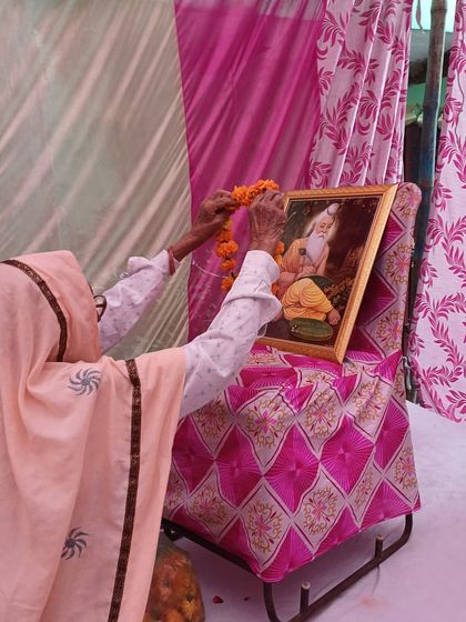 A moment of reverence as a community elder honors Maharishi Valmiki. We ensure that our events respect cultural traditions and create a space for meaningful observance.