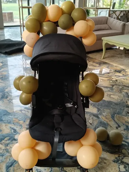 It's the small details that make a big difference. To complete the grand entrance for the birthday baby, I decorated their stroller with matching balloons, ensuring even the littlest guest of honor arrived in style.