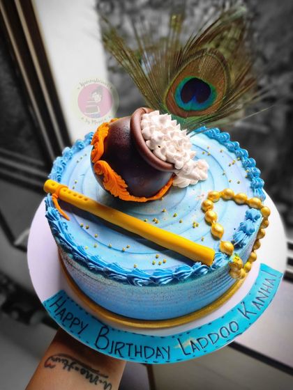 A Janmashtami cake with a spilling matki, perfect for celebrating Krishna's birthday.