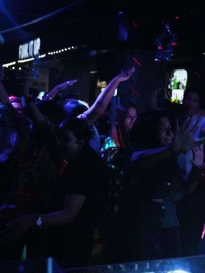 The dance floor under the blue and purple lights. It's all about creating that perfect club atmosphere where people can escape and enjoy the music.