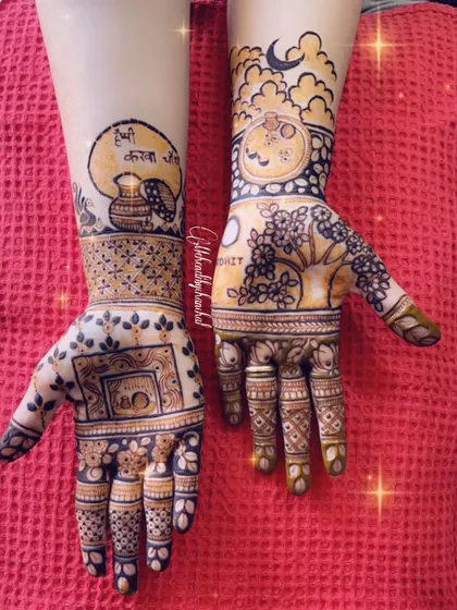 A creative Karwachauth mehendi design. One hand shows the traditional karwa (pot) and sieve, while the other has a portrait of the couple under the moon.