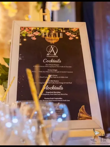 A custom bar menu designed for a wedding. It features personalized cocktail names like 'Devina's Delight' and 'Aman's Nicotine', making the drink selection unique to the couple.