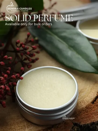 A round tin version of my solid perfume, showing that I can source different packaging options to fit your brand's needs.