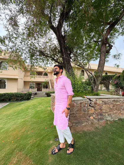Wearing a simple pink kurta and a smile, doing what I love. This is me in my element, ready for an event.