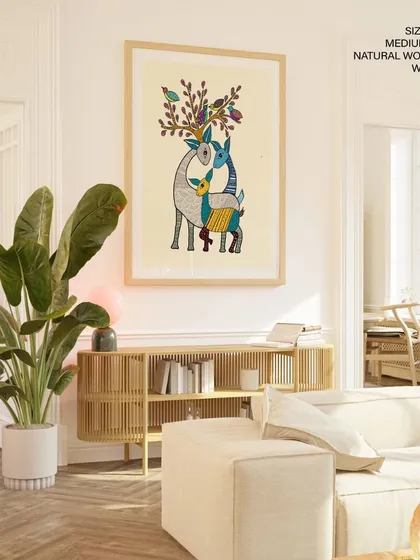 Celebrate the rich heritage of Indian tribal art with this stunning Gond painting of a deer family. Displayed here as a large 48x64 inch canvas print in a natural wood frame, its intricate patterns and vibrant colors make a powerful cultural statement in a modern home.