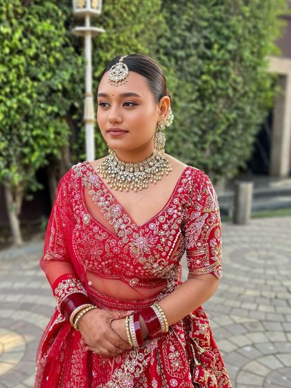 This bride wanted a "no makeup" makeup look with her red lehenga, and she looked absolutely stunning. We focused on a dewy, skin-like base and skipped false lashes to keep it natural.