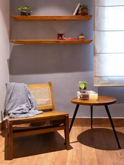 A simple reading corner featuring my 'Mirai' lounge chair and 'Tipoy' side table. This setup shows how my pieces can create a functional and beautiful space for daily relaxation.