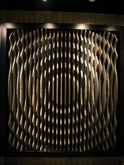 A look at one of our parametric wall installations. The undulating waves are precisely cut to create a fluid, optical effect. This type of wall is perfect for lobbies or feature areas where you want to make a bold, modern statement.