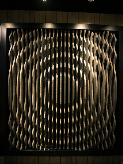 A look at one of our parametric wall installations. The undulating waves are precisely cut to create a fluid, optical effect. This type of wall is perfect for lobbies or feature areas where you want to make a bold, modern statement.