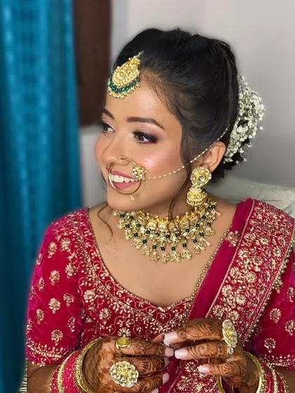A happy, glowing bride. Neha's makeup was designed to look bright and joyful, with a focus on luminous skin and sparkling eyes.