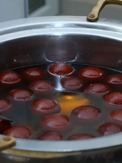 A tempting close-up of our soft, syrup-soaked Gulab Jamuns, a classic Indian dessert and a favorite at all the events we cater.