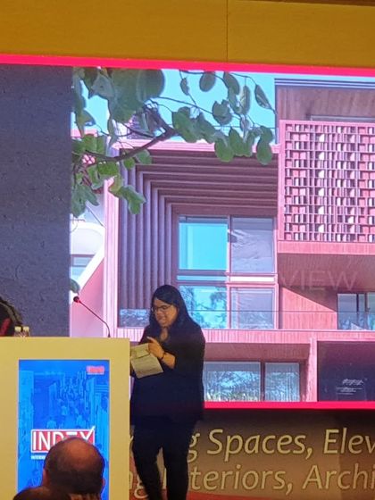 On stage at the IndeXcellence Awards, with our award-winning 'Vrinda' project displayed on the screen behind me. A proud moment celebrating innovation and the art of crafting homes.