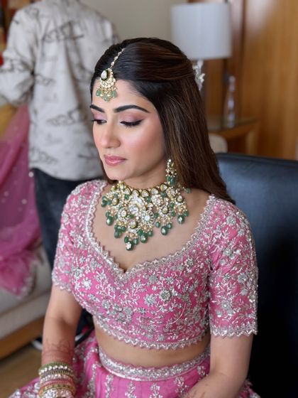 This bride is a vision in her pink lehenga. I teach how to use soft pink tones on the eyes and lips to create a dreamy, romantic look for the wedding day.