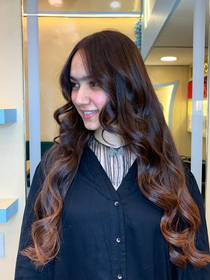 A rich brown for a sophisticated look. We gave our client this elegant chocolate hue with a subtle ombre effect, creating a timeless and classy transformation.