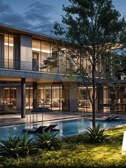 The private swimming pool at the Aravalli farmhouse anchors the landscape. It was designed to be a space of restrained luxury, perfectly integrated with the home's sustainable and nature-centric architecture.