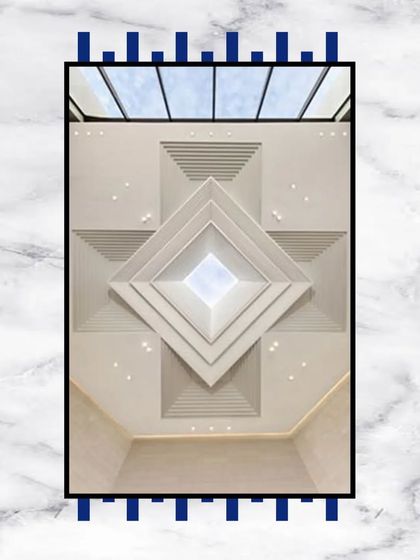 A stunning false ceiling design featuring a geometric, pyramid-like structure with a skylight at its apex. This is a unique architectural feature that floods the space with natural light.