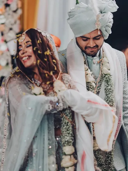 A playful moment during the wedding ceremony. We love it when a couple's personality shines through in every part of their shaadi.