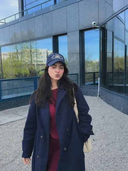 A fun, playful pose in my college outfit, adding personality to the content.
