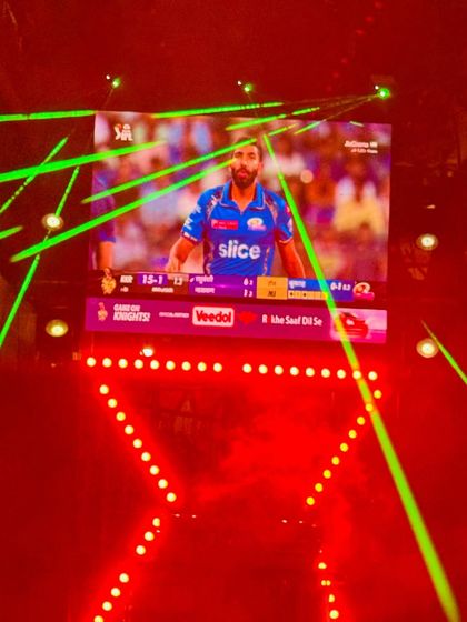 My compact DJ setup is versatile enough for any theme, including an IPL screening party. Here, the LED screen shows the live match, while red and green laser lights add to the excitement.