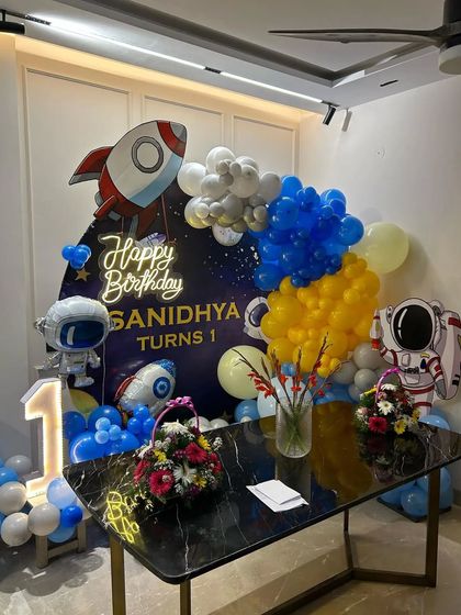 A detailed shot of the space-themed cake table setup.