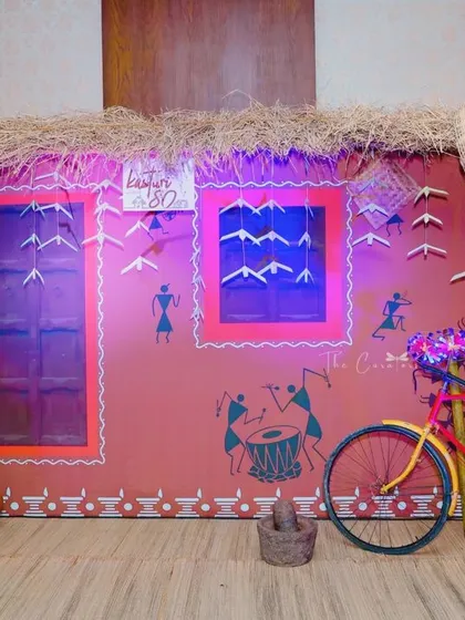 The vibrant colors and authentic details of our village theme decor shine under the event lighting, creating a festive and joyful atmosphere.