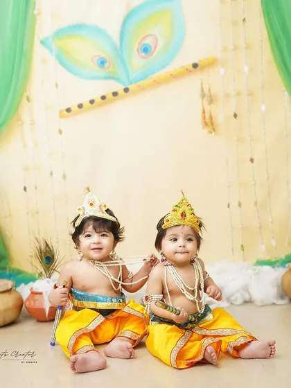 Two little Krishnas sharing a sweet moment. Photographing twins is always a special joy, and this traditional theme makes it even more memorable.