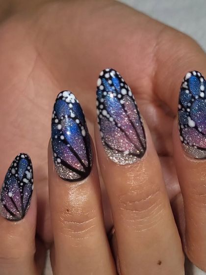 A still image of the enchanting fairy wing nails. The glitter gradient and detailed line work combine to create a truly magical effect.