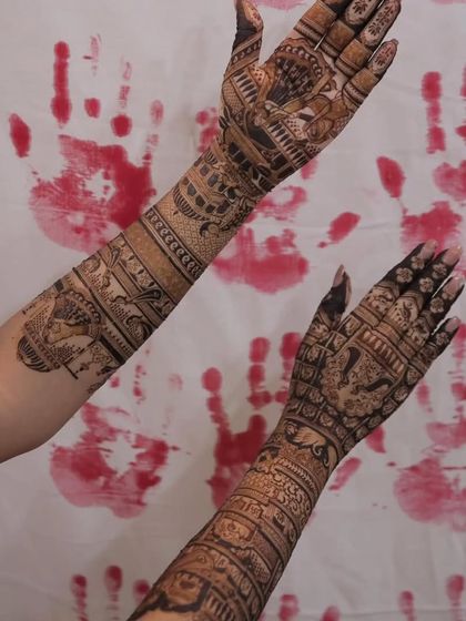 The final mehandi design, displayed against a traditional hand-print background. The rich color and intricate patterns are a result of our expert application.