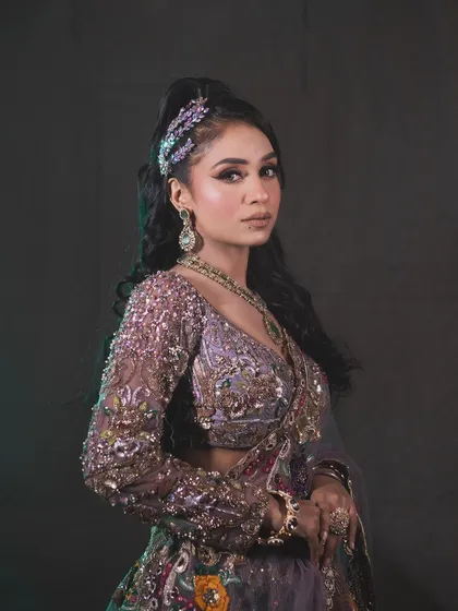A high-fashion shoot look. This features a dramatic, graphic eyeliner and a flawless base, perfect for editorial or creative party makeup.
