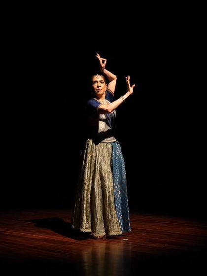 A dancer in a dynamic pose during the "Immersed" performance.