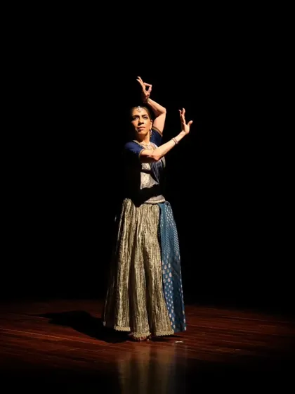 A dancer in a dynamic pose during the "Immersed" performance.