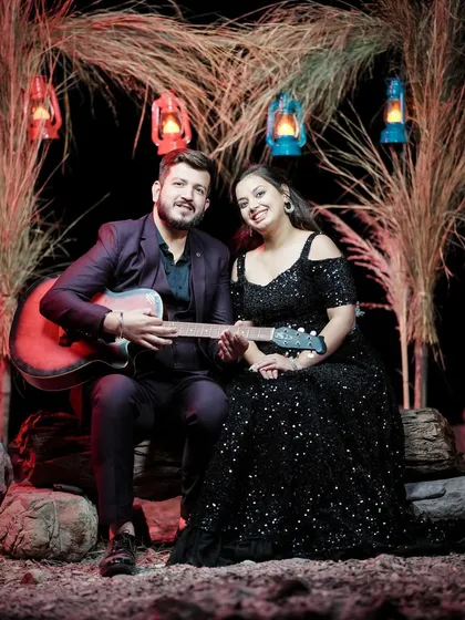 A creative pre-wedding setup with a guitar and rustic decor. This shows how we can incorporate your personal interests into the shoot.