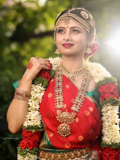 The sunlight catches the bride's face, creating a beautiful glow in this outdoor portrait.