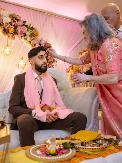 A family member blesses the groom during the Kurmai ceremony. It is a privilege for us to be a part of such significant family milestones.