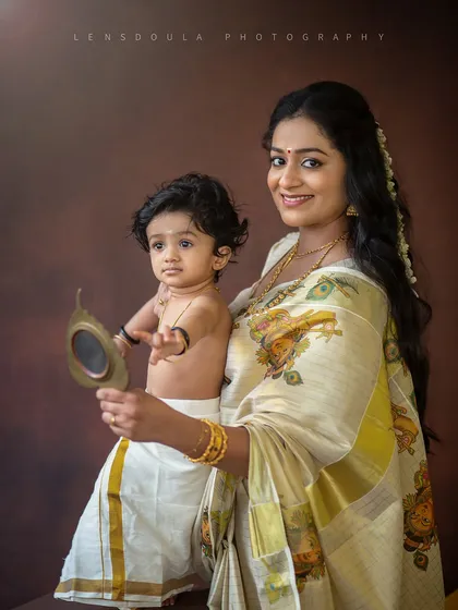 A mother introduces her child to his reflection in a traditional mirror. This is a beautiful way to connect generations and celebrate cultural heritage during a family photoshoot.