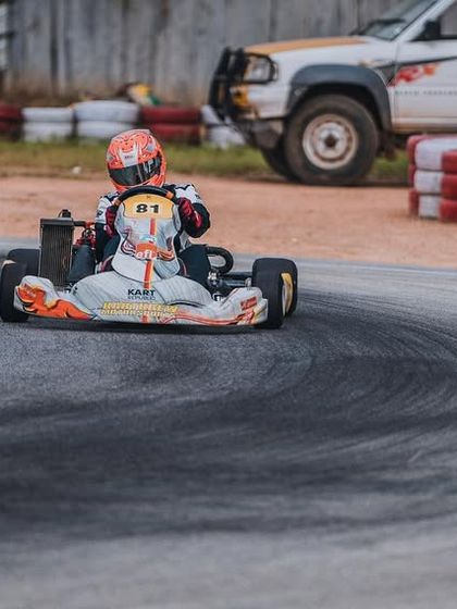 Our driver in the number 81 kart, leaving tyre marks as he pushes the limit through a corner.