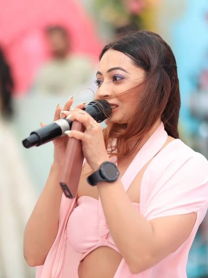 A close-up shot of me in my element, hosting a wedding carnival at The Leela Jaipur. My focus is always on the guests and making sure they are having an incredible time.