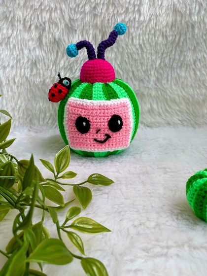 The Cocomelon logo as a plushie! This was a fun and unique request, with the watermelon TV and ladybug friend. The stripes were a challenge, but I love the final result.