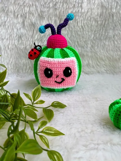The Cocomelon logo as a plushie! This was a fun and unique request, with the watermelon TV and ladybug friend. The stripes were a challenge, but I love the final result.